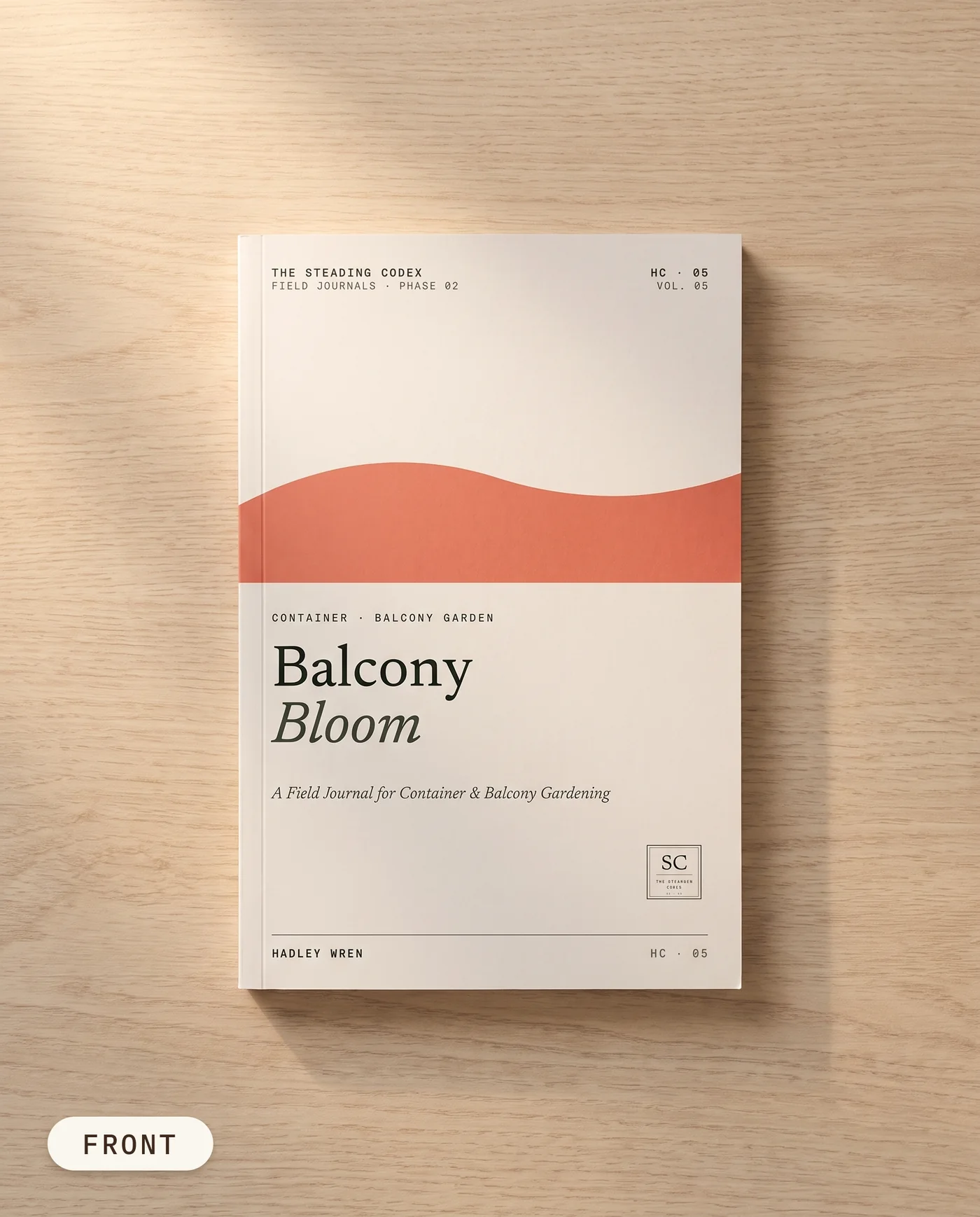 Balcony Bloom container garden journal — front cover on an oak table