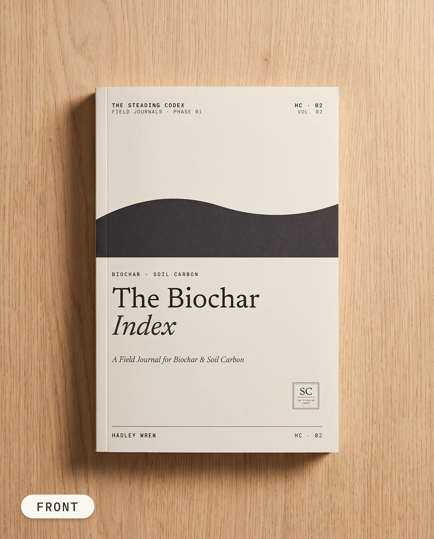 The Biochar Index biochar journal — front cover on an oak table