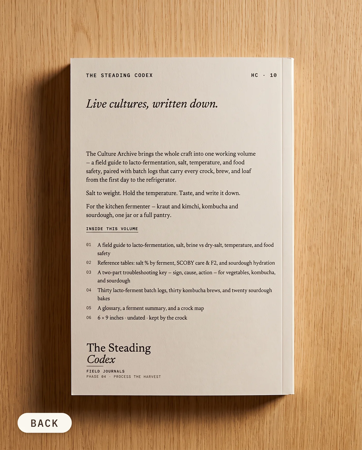 The Culture Archive fermentation journal — back cover on an oak table