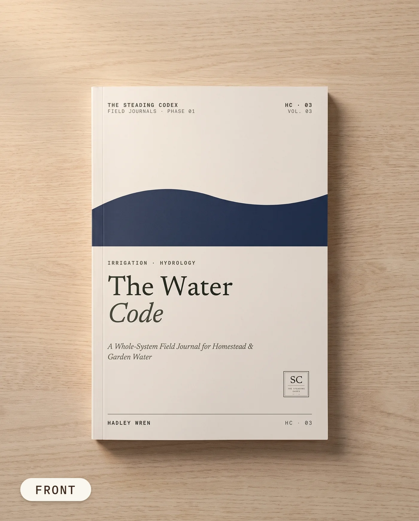 The Water Code homestead water journal — front cover on an oak table